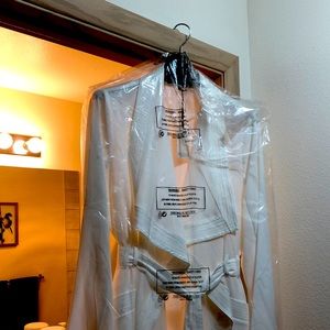 White crepe long jacket in white. Never been worn. Size is 44US (XL).
